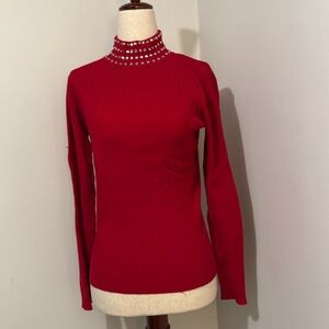 INC red cotton pullover with jewel embellishments on the turtleneck